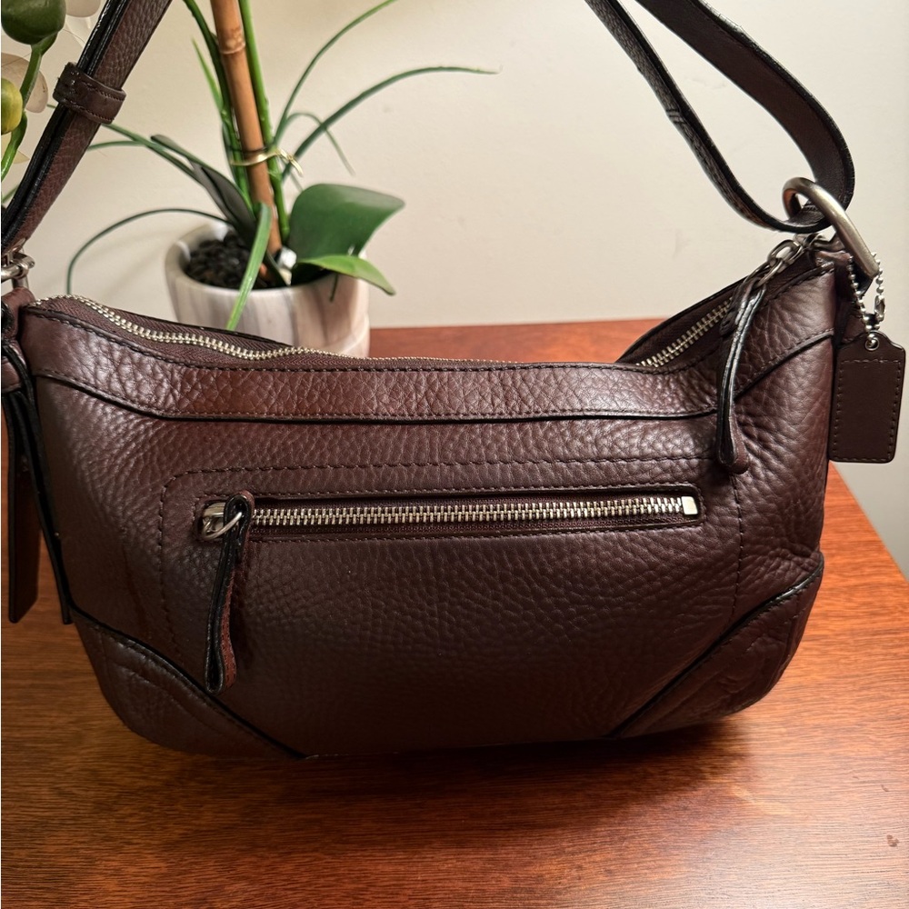 Coach Tan Pebble Leather
Adjustable shoulder strap